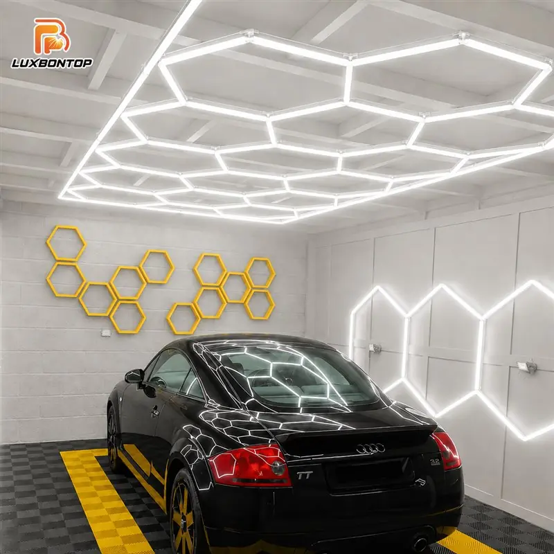 Commercial honeycomb LED lighting installed in a car detailing garage